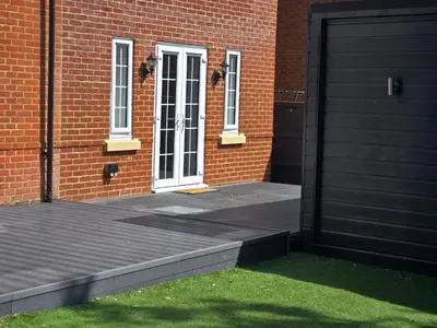a brick building with a door and a ramp leading to a door at Newly Built Studio Apartment in Stevenage