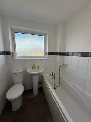 a bathroom with a toilet and a sink and a tub at 3 Bedroom Apartment in Rayleigh Town Centre with Balcony in Rayleigh
