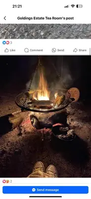 a picture of a campfire with a pot of fire at Riverside farm Yurt tent Hertford in Hertford