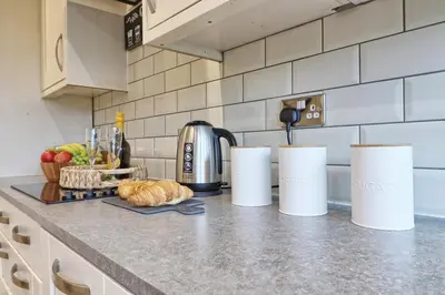 a kitchen with a counter top with a coffee maker at Cozy Modern Home Basildon Long stay Contractors Sleeps 6 in Basildon