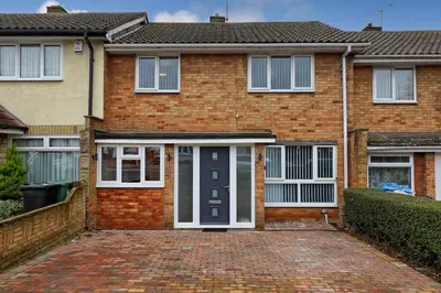 a brick house with a black and white door at Cozy Modern Home Basildon Long stay Contractors Sleeps 6 in Basildon