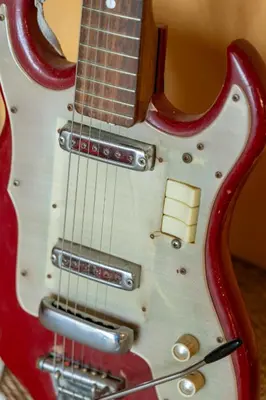 a close up of a red electric guitar at Wodehouse, Eco House - Aldeburgh Coastal Cottages in Aldeburgh