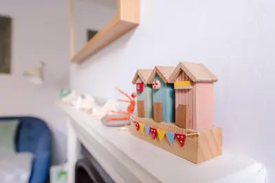 a toy house sitting on top of a counter at Stones Throw, Aldeburgh in Aldeburgh