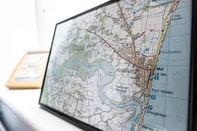 a close up of a map on a desk at Stones Throw, Aldeburgh in Aldeburgh