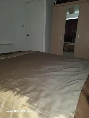 a large bed in a room with at The Home 2 in Mile End