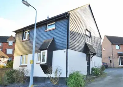 a house with a black and white at Family home in Great Dunmow for up to 5 guests in Great Dunmow