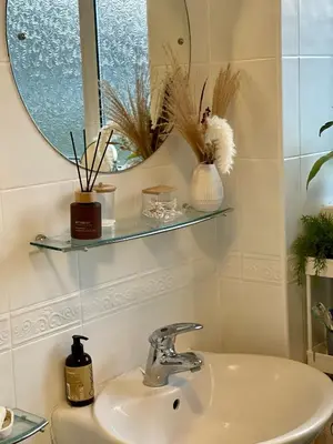a bathroom with a sink and a mirror at Lea Valley Nature Reserve Bright Home with Private Garden - 40 min to London by Train in Nazeing