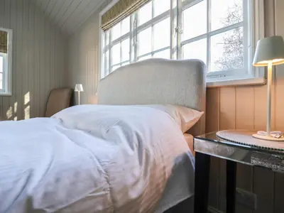 a bedroom with a white bed and a window at The Woodshed in Clacton-on-Sea
