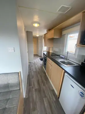 a kitchen with a sink and a counter top at Highfield Grange Holiday Park Clacton in Little Clacton