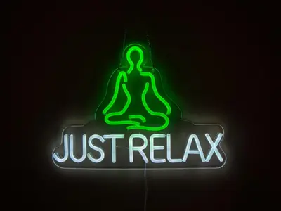 a neon sign that says just relaq at Cambridge - hot tub, sauna, parking, pool table in Trumpington