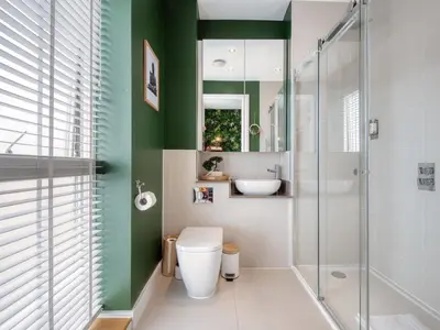 a bathroom with a toilet and a glass shower at Cambridge - hot tub, sauna, parking, pool table in Trumpington