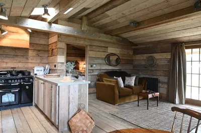 a kitchen with a stove and a couch in a room at The Farmstead in Euston