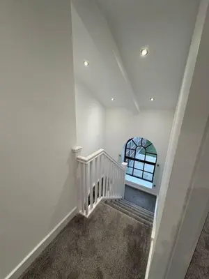a white staircase in a house with a window at Stunning 2-bed house in Great Warley, Brentwood in Great Warley Street