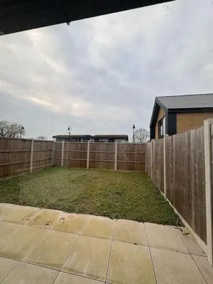 a backyard with a wooden fence and a yard at Stunning 2-bed house in Great Warley, Brentwood in Great Warley Street