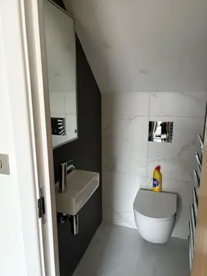 a small bathroom with a sink and a toilet at Stunning 2-bed house in Great Warley, Brentwood in Great Warley Street