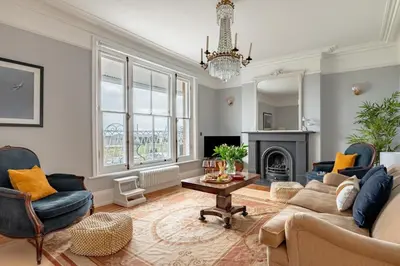 a living room with a couch and chairs and a fireplace at 4 Bed in Aldeburgh oc-e28371 in Aldeburgh