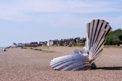 a shell sitting on a sandy beach at 4 Bed in Aldeburgh oc-e28371 in Aldeburgh