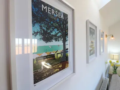 a picture of a poster on a wall in a room at The Hide in Colchester