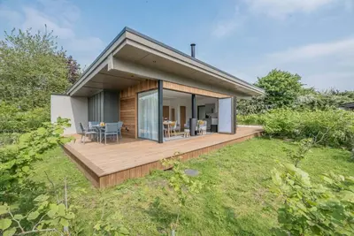 a house with a deck and a dining room at The Haywain, Flatford in East Bergholt