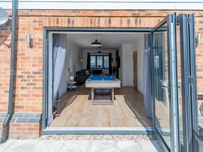 a view of the living room from the extension of the house at Hawkwell Hideaway Large 4 bedroom Home Hockley - Pass the Keys in Hawkwell