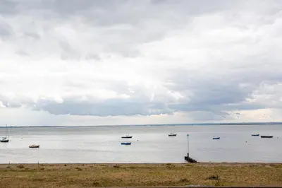 a large body of water with boats in it at Ocean Breeze in Thorpe Bay