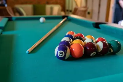 a group of billiard balls on a pool table at Tewinbury Farm Hotel in Tewin