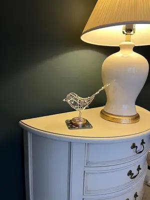a lamp on a table with a toy boat on it at 4 Bedroom Detached House Sleeps 7 in Ipswich
