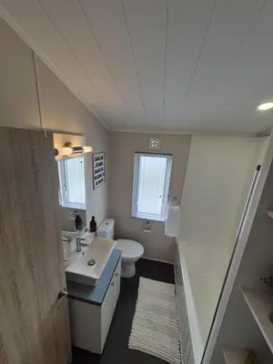 a bathroom with a sink and a toilet at The Blue Lagoon 2 bedroom lodge with hot tub in Walton-on-the-Naze
