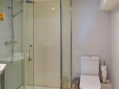 a bathroom with a toilet and a glass shower at Holly No2 - Uk49254 in Althorne