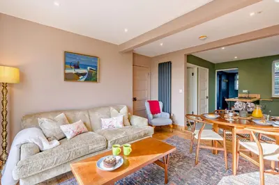 a living room with a couch and a table at 2 Bed in Holbrook oc-31111 in Holbrook