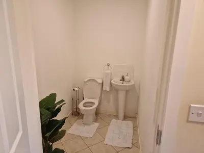 a bathroom with a toilet and a sink at Lovely and Cosy Double Room in Havering atte Bower