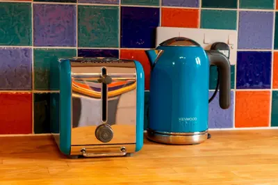 a blue toaster sitting on top of a counter at Pass the Keys Spacious Modern Home near River Cam Free Parking in Cambridge