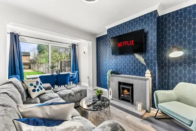 a living room with a couch and a fireplace at Gorgeous Abode in Cambridge - Pet Friendly! in Cherry Hinton