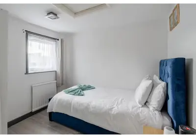 a bedroom with a bed and a window at The Barack Nest Colchester in Colchester