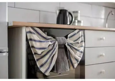 a kitchen with towels hanging from an oven at The Barack Nest Colchester in Colchester