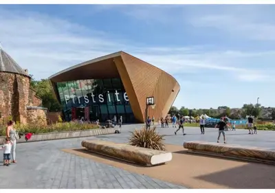 a building with people walking in front of it at The Barack Nest Colchester in Colchester