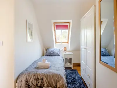 a small bedroom with a bed and a mirror at Cedar - Uk49525 in Saint Lawrence