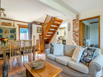 a living room with a couch and a table at Cedar - Uk49525 in Saint Lawrence