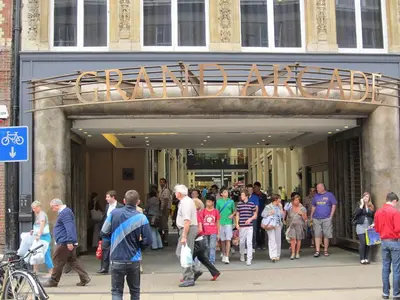 a group of people walking outside of a building at Bright Mews House with Garage in Heart of Cambridge in Cambridge