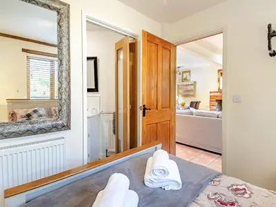 a room with a bed and a mirror and a bedroom at Ash - Uk49524 in Saint Lawrence