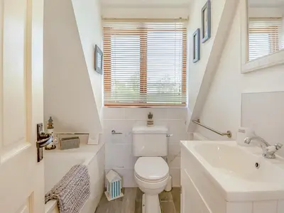 a white bathroom with a toilet and a sink at Ash - Uk49524 in Saint Lawrence