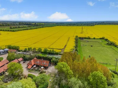 an aerial view of a farm with a house and a field at Ash - Uk49524 in Saint Lawrence