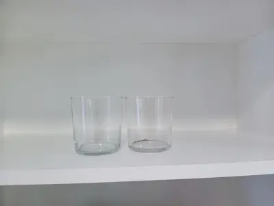 two glass vases sitting on a shelf at Central en-suite room, WIFI, Kitchen and Laundry Access - room 5 in Ipswich