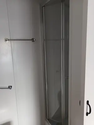 a shower stall with a glass door in a bathroom at Central en-suite room, WIFI, Kitchen and Laundry Access - room 5 in Ipswich