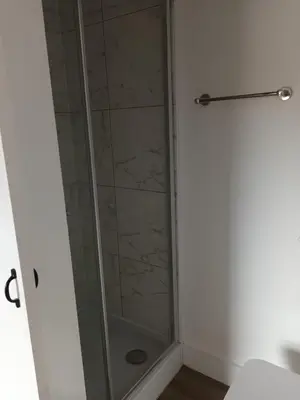 a shower with a glass door in a bathroom at Central en-suite room, WIFI, Kitchen and Laundry Access - room 5 in Ipswich