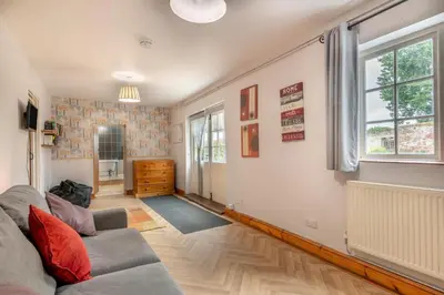 a living room with a couch and a window at 4 Bed in East Harling oc-m31907 in East Harling