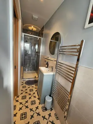 a bathroom with a sink and a toilet in it at Gala Suite - The Apple Barn in Pettistree