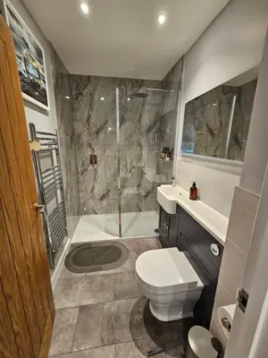 a bathroom with a toilet and a sink and a shower at Discovery Suite - The Apple Barn in Pettistree