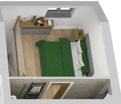 an overhead view of a bedroom with a green bed at Cameo Suite - The Apple Barn in Pettistree