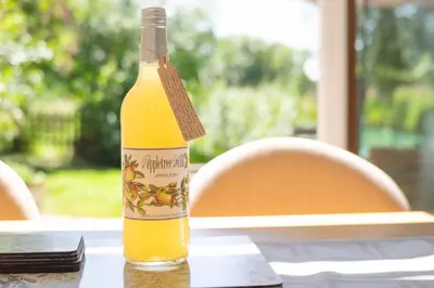 a bottle of orange juice sitting on a table at Welhams Meadow Holiday Lodges in Ringshall